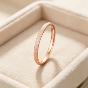 Detailed close-up showing the elegant frosted starry sky finish on a rose gold titanium steel ring