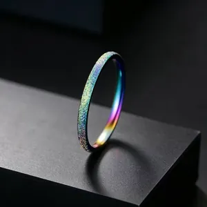 Macro view of a thin titanium steel ring with a frosted rainbow iridescent finish
