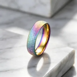 Macro detail of rainbow frosted titanium steel ring with glittery starlight texture