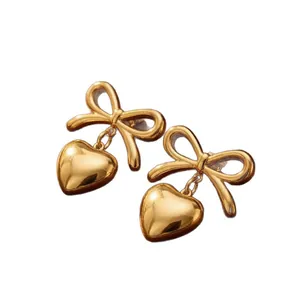 Elegant gold bow earrings with heart-shaped dangles, sweet stainless steel jewelry