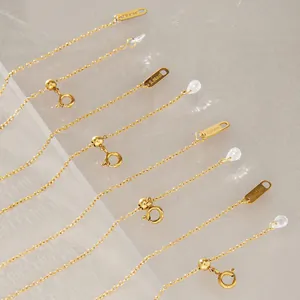 Detail of gold-plated stainless steel chains with dainty clear zircon teardrops