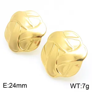 Close-up detail of 24mm stainless steel gold button stud earrings with textured design