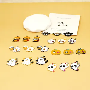 Detailed macro view of various colorful Halloween enamel alloy charms on a yellow background