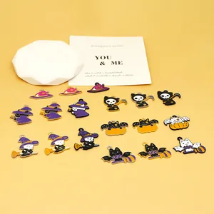 Selection of colorful Halloween DIY enamel charms featuring pumpkins, cats, and ghosts