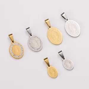 Detailed macro view of various stainless steel oval religious pendants in gold and silver