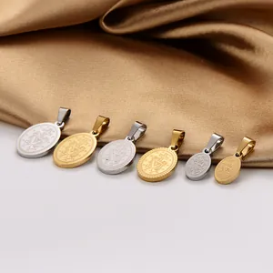 Detailed macro view of 304 stainless steel oval religious pendants in gold and silver