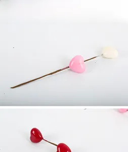 Close-up detail of artificial heart-shaped decorative floral stems for DIY crafts