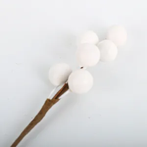 White artificial Christmas berry sprig for festive DIY floral arrangements and decor