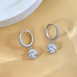 Close-up of 925 sterling silver hoop earrings with brilliant six-prong round cubic zirconia