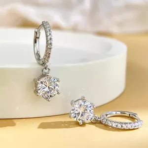 Detailed view of 925 sterling silver six-prong earrings with brilliant cut stones