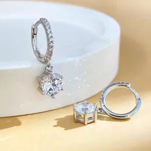 Close-up of 925 sterling silver six-claw hoop earrings with sparkling cubic zirconia.