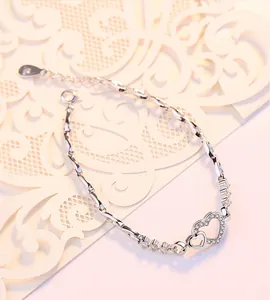 Elegant S925 sterling silver interlocking heart bracelet with sparkling micro-pave crystals