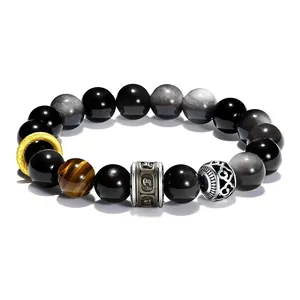 Detailed view of 10mm silver obsidian and tiger eye bracelet with engraved mantra bead.