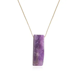 Close-up of a rectangular natural amethyst pendant necklace with a fine golden chain