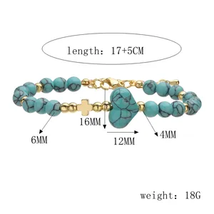 Vista dettagliata del bracciale in turchese con dimensioni e ciondolo a cuore oro