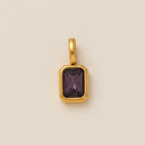 Close-up of purple zircon birthstone charm for shoes or necklaces in 18K gold plating