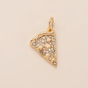 Detailed close-up of a gold-plated pizza slice charm with sparkling crystal rhinestones