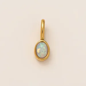 Detail showing the iridescent shimmer of the 18K gold-plated opal shoe charm
