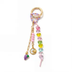 Close-up of DIY fashion keychain with colorful heart beads and 18K gold charms