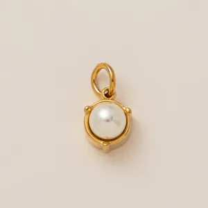 Close-up of 18K gold plated stainless steel pendant with white pearl bead detail