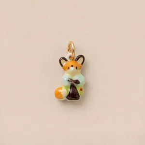 Detailed macro view of a cute colorful fox enamel charm pendant for DIY keychain or bag accessory.