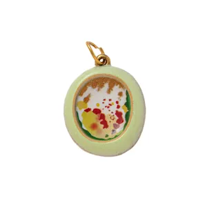Vintage style pale green circular DIY shoe charm with colorful abstract floral pattern