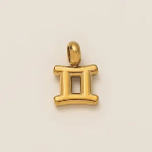 Detailed view of a golden Gemini zodiac pendant made of 18K gold plated stainless steel