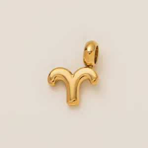 Detailed view of an 18K gold plated stainless steel Aries zodiac sign charm pendant