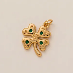 Golden four-leaf clover DIY charm with green stones for jewelry or shoe decoration