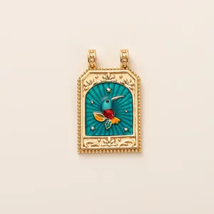 Detailed view of an ornate gold tarot card pendant featuring a hummingbird