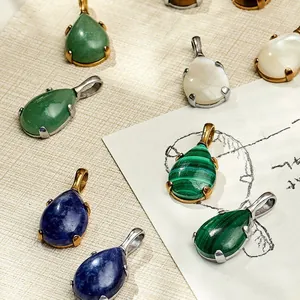 Teardrop pendants with assorted gemstones in gold and silver titanium steel settings