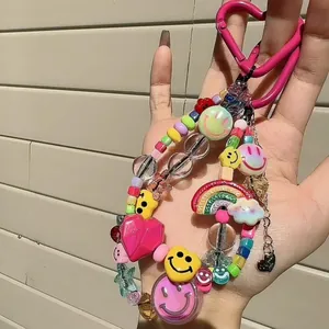 Cute colorful Y2K beaded charm for bags and phones with smiley face, rainbow and heart details