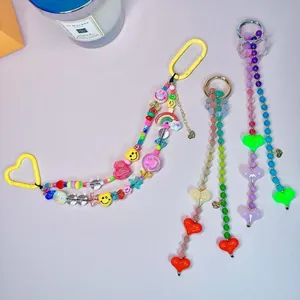 Colorful beaded heart and smiley face charms for bags and phone cases DIY accessories.