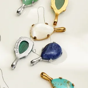Macro detail view of diverse teardrop gemstone pendants with elegant gold and silver plating