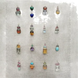 Colección de diversos colgantes de acero inoxidable y piedra natural para joyería