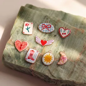 Colorful enamel stainless steel pendants featuring heart, sun, and bow motifs in a variety pack.