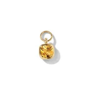 Close-up of a square yellow zircon pendant in gold stainless steel
