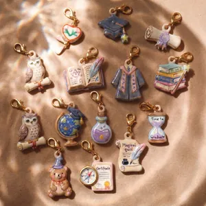 Set of graduation season mini charms including academic cap gown and certificate