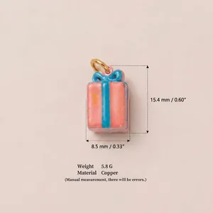 Enamel painted pink gift box charm pendant with blue ribbon detail, copper material