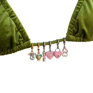 Stainless steel bikini charms with MOM and heart designs on a green velvet strap
