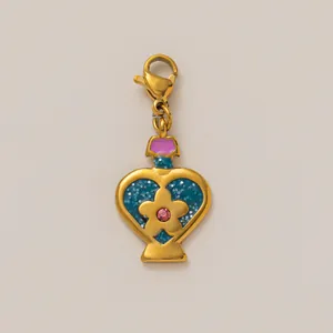 Detailed view of a gold-plated stainless steel heart-shaped charm with blue glitter