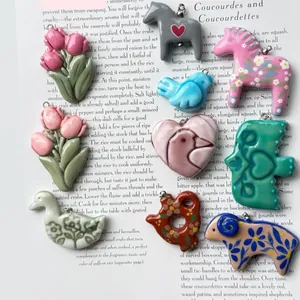 Various colorful enamel animal and flower pendants made of steel for DIY necklaces