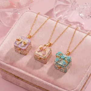 Close-up detail of fairy tale locket necklaces with ballet shoes and pearl bow designs