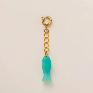 Teal resin fish charm pendant featuring a gold stainless steel chain and spring ring clasp
