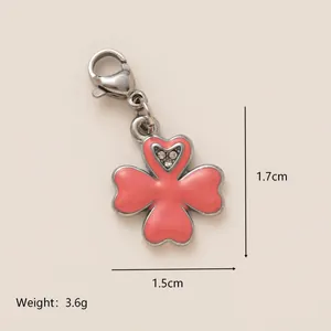 Pink enamel four-leaf clover charm pendant with a crystal heart and lobster clasp