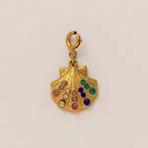 Detailed close-up of a gold seashell charm featuring vibrant multi-colored rhinestones
