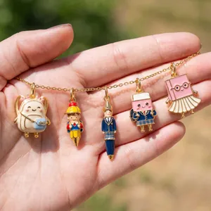 Macro detail of cute school stationery enamel pendants with backpack and pencil designs
