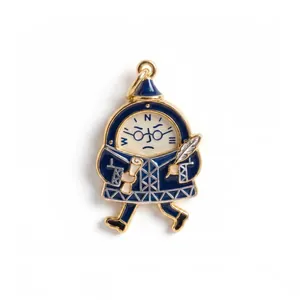 Detail view of a cute cartoon character pendant in blue enamel with compass markings