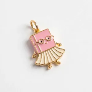 Close-up of a cute pink book pendant charm with glasses and a pleated skirt detail