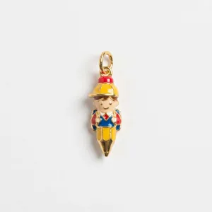 Close-up detail of a cute cartoon boy pencil charm with a vibrant colorful enamel finish